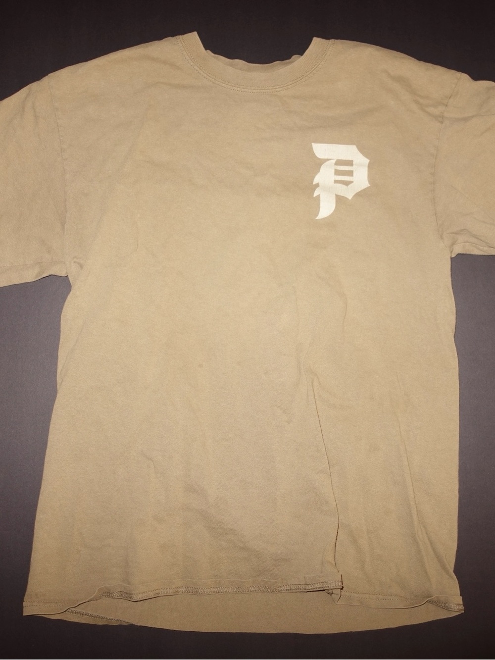 Tan Primitive Skateboarding cotton t-shirt with white stylized 'P' logo, size M